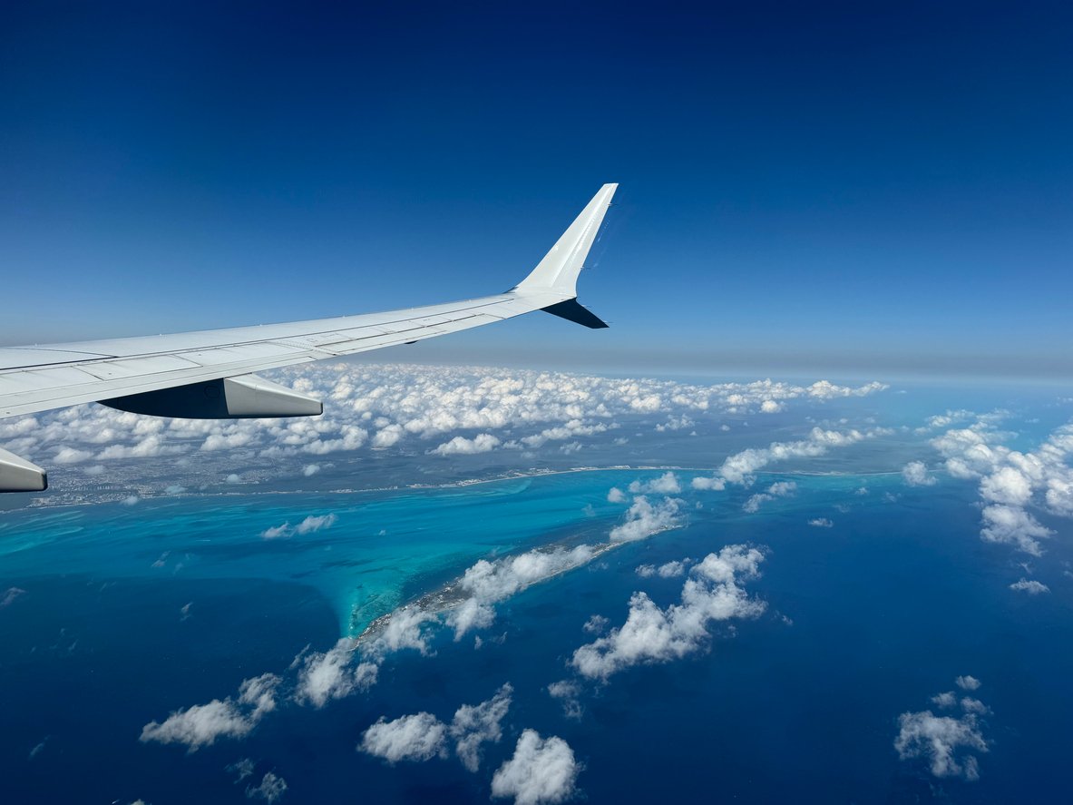 Airplane wing sky beach view
